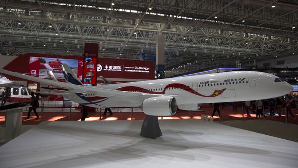 A mock-up scale model of the proposed COMAC C929, a wide-bodied commercial jet to be made by Commercial Aircraft Corporation of China (COMAC) and Russia’s United Aircraft Corporation (UAC), is seen on display during the Zhuhai Air Show in Zhuhai, southern China's Guangdong province, on November 3, 2016. - Sputnik International