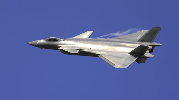 In this photo provided by China's Xinhua News Agency, the J-20 stealth fighter jet flies at the China's International Aviation and Aerospace Exhibition in Zhuhai on Tuesday, Nov. 1, 2016 - Sputnik International
