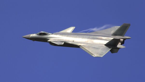 In this photo provided by China's Xinhua News Agency, the J-20 stealth fighter jet flies at the China's International Aviation and Aerospace Exhibition in Zhuhai on Tuesday, Nov. 1, 2016 - Sputnik International