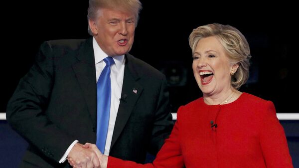 Republican U.S. presidential nominee Donald Trump shakes hands with Democratic U.S. presidential nominee Hillary Clinton - Sputnik International