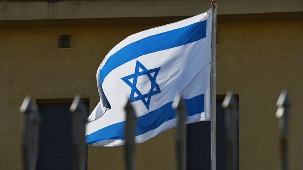 The flag on the premises of the Embassy of Israel in Moscow which has suspended its operations as the diplomats go on strike. - Sputnik International