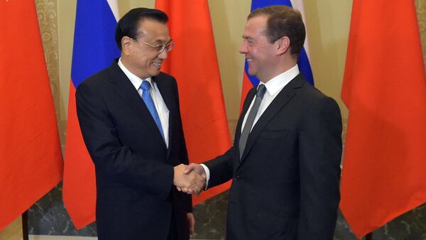 Russian Prime Minister Dmitry Medvedev and Chinese State Council Premier Li Keqiang during the 21st regular meeting between Russian and Chinese government heads in St. Petersburg - Sputnik International