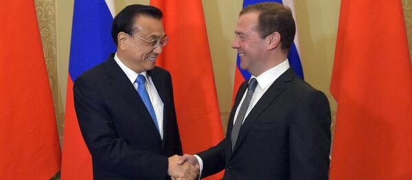 Russian Prime Minister Dmitry Medvedev and Chinese State Council Premier Li Keqiang during the 21st regular meeting between Russian and Chinese government heads in St. Petersburg Russian Prime Minister Dmitry Medvedev and Chinese State Council Premier Li Keqiang during the 21st regular meeting between Russian and Chinese government heads in St. Petersburg - Sputnik International