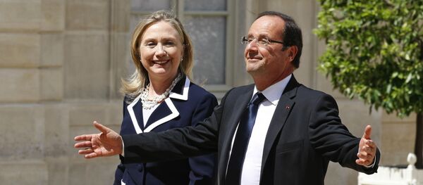 US Secretary of State Hillary Rodham Clinton is greeted by French President Francois Hollande prior to their meeting at the Elysee Palace in Paris (File) - Sputnik International