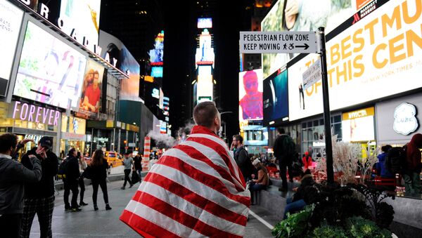 Anthony Agli, from Connecticut, watches a screen where U.S. election results were shown in Times Square in New York, U.S., November 9, 2016 - Sputnik International