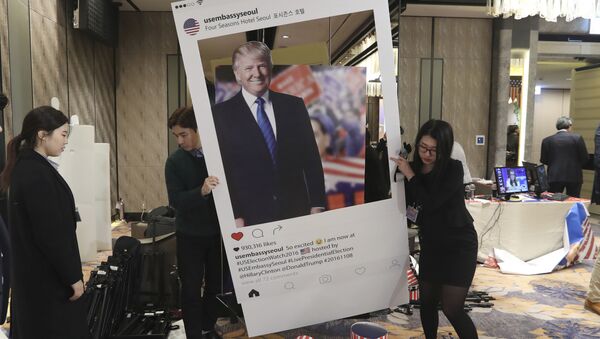 Officials carry a cardboard of Republican presidential candidate Donald Trump following an Election Watch event hosted by the U.S. Embassy in Seoul, South Korea, Wednesday, Nov. 9, 2016 - Sputnik International