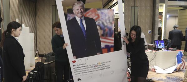 Officials carry a cardboard of Republican presidential candidate Donald Trump following an Election Watch event hosted by the U.S. Embassy in Seoul, South Korea, Wednesday, Nov. 9, 2016 Officials carry a cardboard of Republican presidential candidate Donald Trump following an Election Watch event hosted by the U.S. Embassy in Seoul, South Korea, Wednesday, Nov. 9, 2016 - Sputnik International