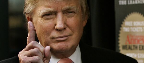 This file photo taken on October 16, 2007 shows Real estate developer Donald J. Trump holding up a copy of his new book written with Bill Zanker, president and founder of The Learning Annex, called Think Big and Kick Ass outside Barnes & Noble on 5th Avenue in New York This file photo taken on October 16, 2007 shows Real estate developer Donald J. Trump holding up a copy of his new book written with Bill Zanker, president and founder of The Learning Annex, called Think Big and Kick Ass outside Barnes & Noble on 5th Avenue in New York - Sputnik International
