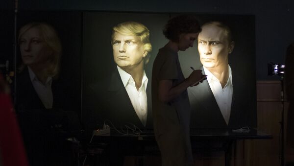 A journalist writes a material as she watches a live telecast of the U.S. presidential election standing at portraits of U.S. presidential candidate Donald Trump and Russian President Vladimir Putin in the Union Jack pub in Moscow, Russia, Wednesday, Nov. 9, 2016 - Sputnik International