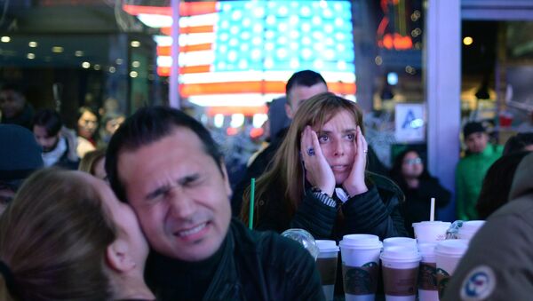 Supporters of Democratic candidate Hillary Clinton on Times Square in New York follow the preliminary vote results - Sputnik International