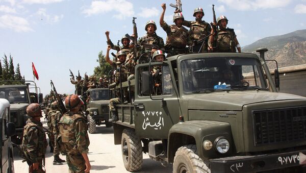 Syrian army soldiers standing on their military trucks chanting slogans in support of Syrian President Bashar Assad, as they enter a village near the town of Jisr al-Shughour, north of Damascus, Syria (File) - Sputnik International