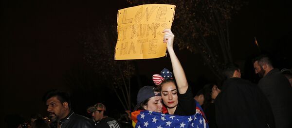 Supporters of Democratic presidential candidate Hillary Clinton react outside the White House early November 9, 2016 in Washington, DC - Sputnik International