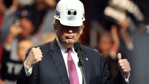 Republican presidential candidate Donald Trump puts on a miners hard hat during a rally in Charleston, W.Va., Thursday, May 5, 2016 - Sputnik International