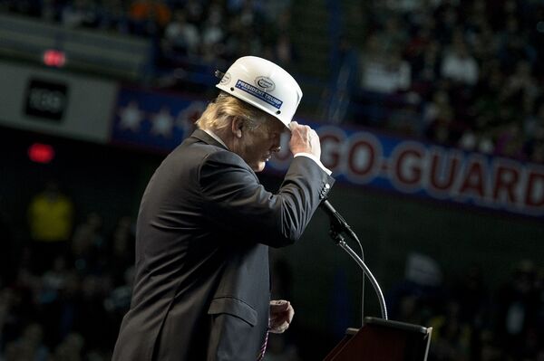 US Republican presidential candidate Donald Trump puts on a miner's hat while speaking during a rally on May 5, 2016 in Charleston, West Virginia - Sputnik International