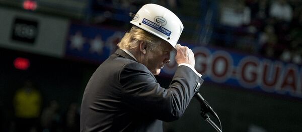 US Republican presidential candidate Donald Trump puts on a miner's hat while speaking during a rally on May 5, 2016 in Charleston, West Virginia - Sputnik International