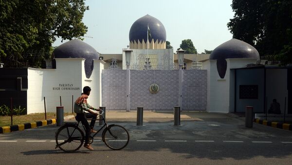 An Indian cyclist rides past the entrance to the Pakistan High Commission in New Delhi on October 27, 2016 - Sputnik International