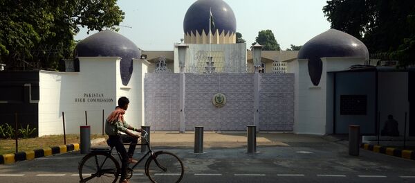 An Indian cyclist rides past the entrance to the Pakistan High Commission in New Delhi on October 27, 2016 - Sputnik International