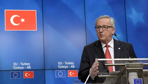 European Union Commission President Jean-Claude Juncker talks to the media at the end of an European Union Summit held at the EU Council building in Brussels, Friday March 18, 2016. - Sputnik International