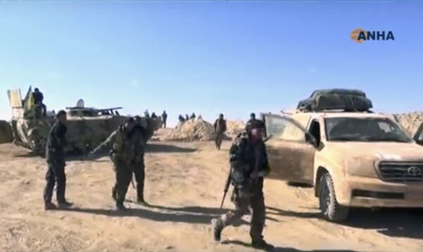 This frame grab from video provided on Monday, Nov. 7, 2016, by the Hawar News Agency, shows U.S.-backed fighters deployed during fighting with the Islamic State group in the village of Laqtah, north of Raqqa, Syria This frame grab from video provided on Monday, Nov. 7, 2016, by the Hawar News Agency, shows U.S.-backed fighters deployed during fighting with the Islamic State group in the village of Laqtah, north of Raqqa, Syria - Sputnik International