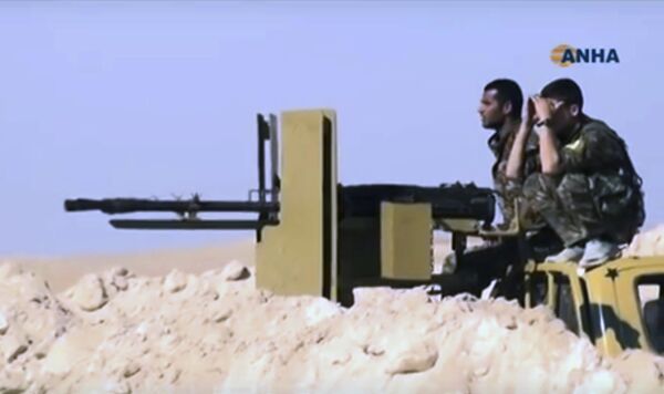 This frame grab from video provided on Monday, Nov. 7, 2016, by the Hawar News Agency, shows U.S.-backed fighters take position during fighting with the Islamic State group in the village of Laqtah, north of Raqqa, Syria This frame grab from video provided on Monday, Nov. 7, 2016, by the Hawar News Agency, shows U.S.-backed fighters take position during fighting with the Islamic State group in the village of Laqtah, north of Raqqa, Syria - Sputnik International