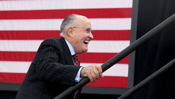 Former New York City mayor Rudy Giuliani smiles as he takes the stage to speak before Republican presidential candidate Donald Trump at an event on October 15, 2016 in Portsmouth, New Hampshire - Sputnik International