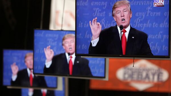 Donald Trump is shown on TV monitors in the media filing room on the campus of University of Nevada, Las Vegas, during the last 2016 U.S. presidential debate in Las Vegas, US, October 19, 2016. - Sputnik International