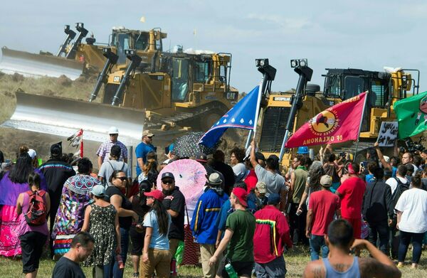 Members of the Standing Rock Sioux Tribe and their supporters opposed to the Dakota Access Pipeline (DAPL) confront bulldozers working on the new oil pipeline in an effort to make them stop, September 3, 2016, near Cannon Ball, North Dakota - Sputnik International