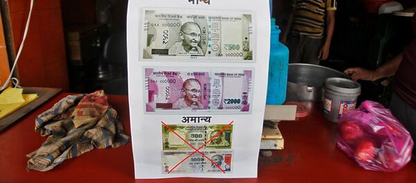 A notice is pasted at a shop stating the refusal of the acceptance of the old 500 and 1000 Indian rupee banknotes and acceptance of the new 500 and 2000 Indian rupee banknotes, in Allahabad, India, November 10, 2016 A notice is pasted at a shop stating the refusal of the acceptance of the old 500 and 1000 Indian rupee banknotes and acceptance of the new 500 and 2000 Indian rupee banknotes, in Allahabad, India, November 10, 2016 - Sputnik International