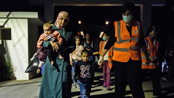 Refugees arrive at the Kokkinotrimithia refugee camp, some 20 kilometres outside the Cypriot capital Nicosia, on November 10, 2016, after they were rescued by police off the northwestern coast of the island - Sputnik International
