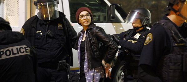 Police detain a demonstrator during a protest against the election of Republican Donald Trump as President of the United States in Portland, Oregon, U.S. November 10, 2016 Police detain a demonstrator during a protest against the election of Republican Donald Trump as President of the United States in Portland, Oregon, U.S. November 10, 2016 - Sputnik International
