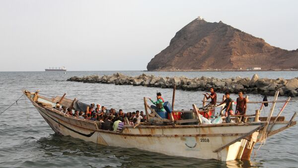 African illegal immigrants sit on a boat in the southern port city of Aden on September 26, 2016, before being deported to Somalia - Sputnik International