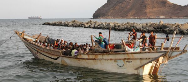 African illegal immigrants sit on a boat in the southern port city of Aden on September 26, 2016, before being deported to Somalia - Sputnik International