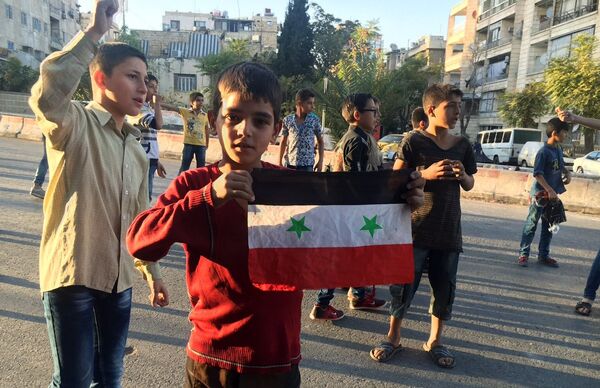 Children in the humanitarian corridor Bustan al-Qasr on the Eastern-Western Aleppo border, Syria. Children in the humanitarian corridor Bustan al-Qasr on the Eastern-Western Aleppo border, Syria. - Sputnik International