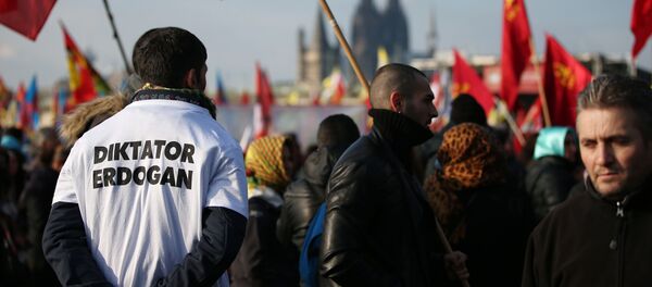 Kurds and Alevites protesters attend a protest rally in Cologne against Turkish Prime minister Recep Tayyip Erdogan Kurds and Alevites protesters attend a protest rally in Cologne against Turkish Prime minister Recep Tayyip Erdogan - Sputnik International