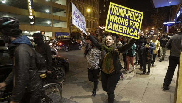 Demonstrators march following a protest against President-elect Donald Trump in downtown Indianapolis on Saturday, Nov. 12, 2016. - Sputnik International