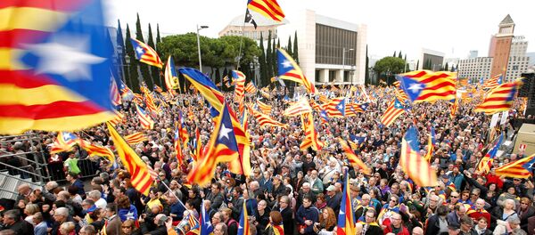 People hold Catalan separatist flags, known as Esteladas, during a gathering to protest against legal challenges made by Spain's government against pro-independence Catalan politicians, in Barcelona, Spain, November 13, 2016. People hold Catalan separatist flags, known as Esteladas, during a gathering to protest against legal challenges made by Spain's government against pro-independence Catalan politicians, in Barcelona, Spain, November 13, 2016. - Sputnik International