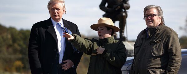 Interpretive park ranger Caitlin Kostic, center, gives a tour near the high-water mark of the Confederacy at Gettysburg National Military Park to Republican presidential candidate Donald Trump, left, and campaign CEO Steve Bannon, Saturday, Oct. 22, 2016, in Gettysburg. - Sputnik International