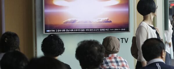 People watch a TV news program reporting North Korea's nuclear test at Seoul Railway Station in Seoul, South Korea. (File) People watch a TV news program reporting North Korea's nuclear test at Seoul Railway Station in Seoul, South Korea. (File) - Sputnik International