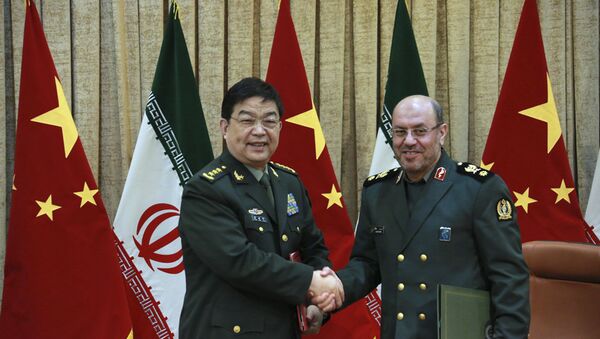 In this picture released by the Iranian Defense Ministry, Iranian Defense Minister Gen. Hossein Dehghan, right, and his Chinese counterpart Chang Wanquan shake hands after exchanging documents of an agreement in Tehran, Iran, Monday, Nov. 14, 2016. - Sputnik International