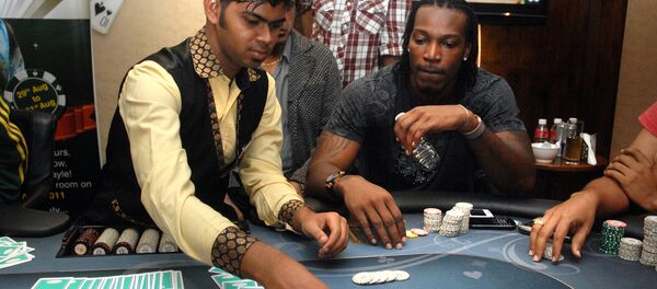 West Indies cricketer Chris Gayle plays poker on a floating casino in Panaji, Goa. (File) West Indies cricketer Chris Gayle plays poker on a floating casino in Panaji, Goa. (File) - Sputnik International
