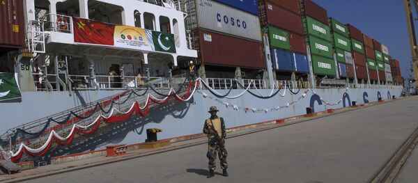 A Pakistan Navy soldier stands guard while a loaded Chinese ship prepares to depart, at Gwadar port, about 700 kilometers (435 miles) west of Karachi. Pakistan, Sunday, Nov. 13, 2016. A Pakistan Navy soldier stands guard while a loaded Chinese ship prepares to depart, at Gwadar port, about 700 kilometers (435 miles) west of Karachi. Pakistan, Sunday, Nov. 13, 2016. - Sputnik International