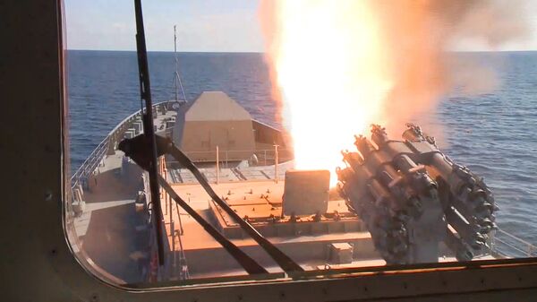Admiral Grigorovich frigate launching its cruise missiles off the coast of Syria. RBU-6000 rocket launcher featured in the foreground. Admiral Grigorovich frigate launching its cruise missiles off the coast of Syria. RBU-6000 rocket launcher featured in the foreground. - Sputnik International