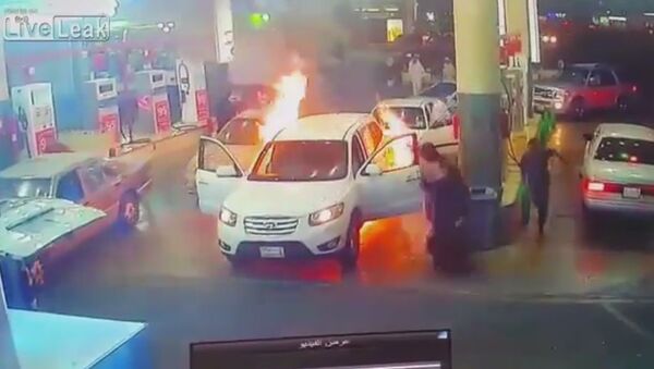 Car catches on fire at gas station during refueling - Sputnik International