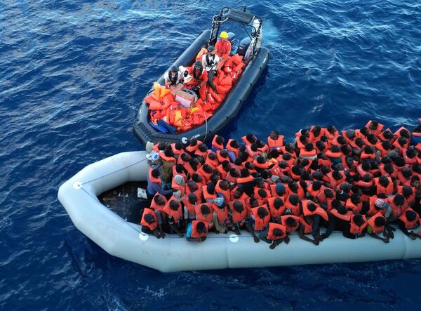 Migrants in a dinghy are rescued by the vessel Burbon Argos, run by Doctors Without Borders organization, in the Mediterranean sea, Friday, Nov. 4, 2016 Migrants in a dinghy are rescued by the vessel Burbon Argos, run by Doctors Without Borders organization, in the Mediterranean sea, Friday, Nov. 4, 2016 - Sputnik International