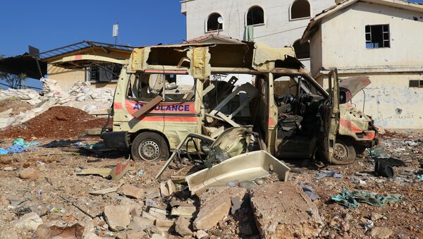 A damaged ambulance is pictured after an airstrike on the rebel-held town of Atareb, in the countryside west of Aleppo, Syria November 15, 2016 - Sputnik International
