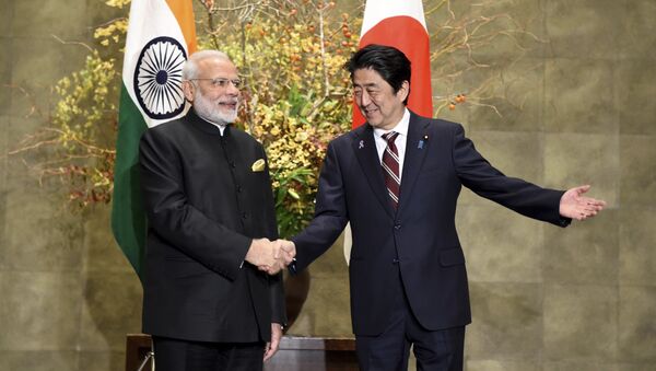 Indian Prime Minister Narendra Modi, left, is welcomed by his Japanese counterpart Shinzo Abe upon his arrival for their meeting at Abe's official residence in Tokyo, Friday, Nov. 11, 2016 - Sputnik International