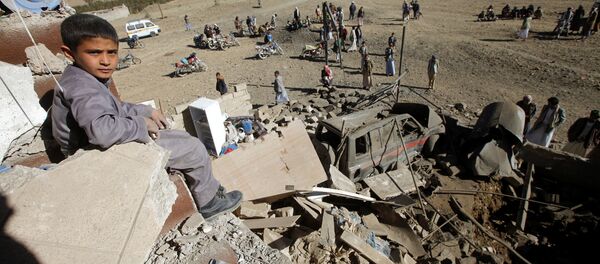 A boy looks at the camera as he sits on the wreckage of a house destroyed by a Saudi-led air strike on the outskirts of Sanaa, Yemen, November 13, 2016 A boy looks at the camera as he sits on the wreckage of a house destroyed by a Saudi-led air strike on the outskirts of Sanaa, Yemen, November 13, 2016 - Sputnik International