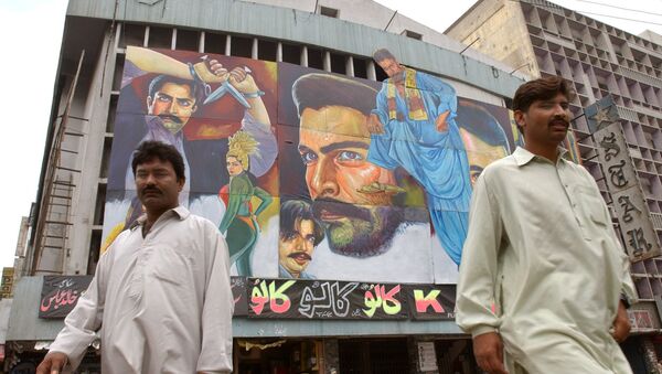 Passers-by walk in front of a movie theater in Karachi, Pakistan (File) - Sputnik International