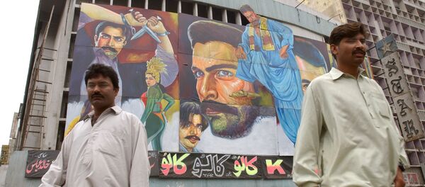 Passers-by walk in front of a movie theater in Karachi, Pakistan (File) - Sputnik International