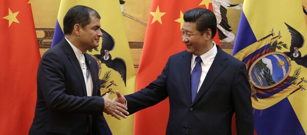 Chinese President Xi Jinping (R) shakes hands with Ecuador's President Rafael Correa after they witnessed a signing ceremony at the Great Hall of the People in Beijing (File) - Sputnik International